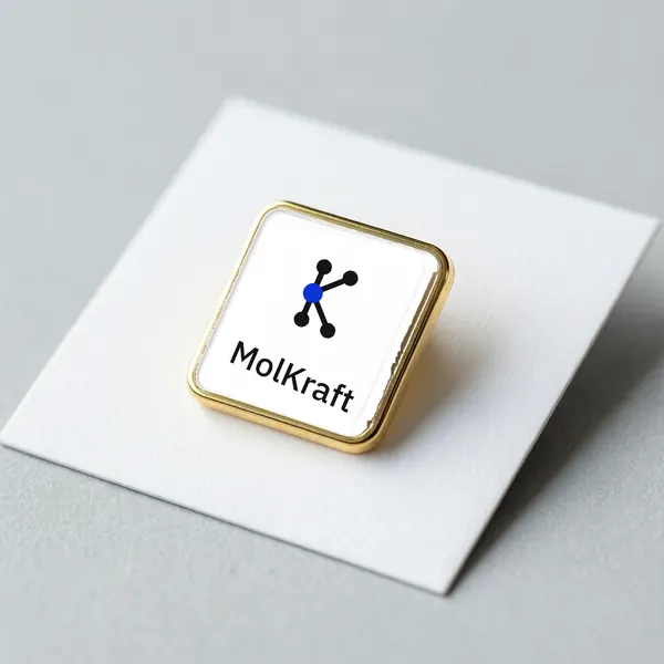 A square gold-edged enamel pin with the MolKraft K logo and wordmark